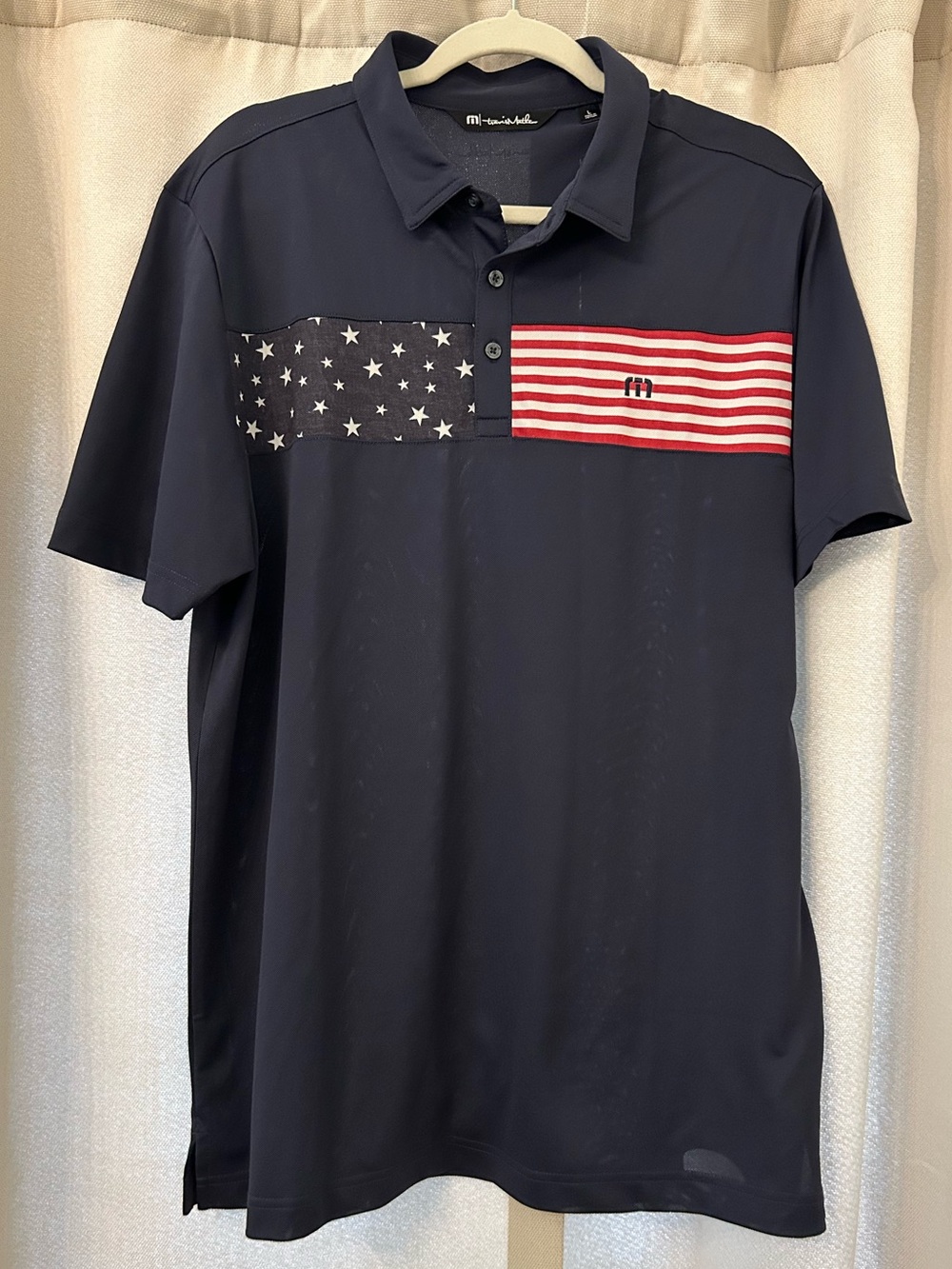 Travis Mathew Navy Polo with Stars & Stripes Chest Panel